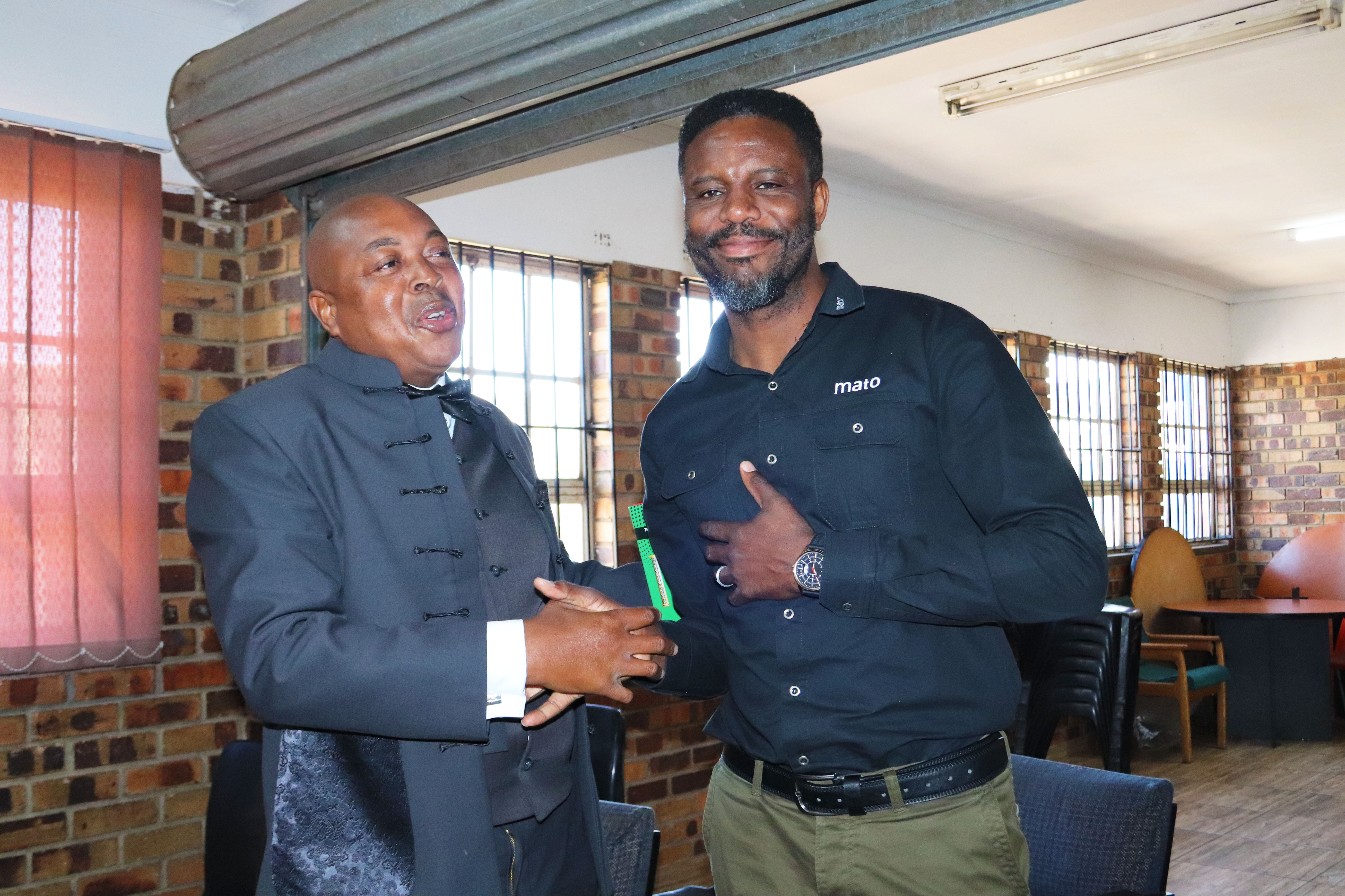 Benjamin Sibanda - Managing Director MATO Products and Zet Baloyi, the principal of Nyiko Primary School.