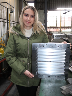 Multotec Manufacturing Jnior Draughtsperson, Zelda Zonneveld, with her innovation.